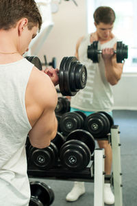 Young man exercising in gym