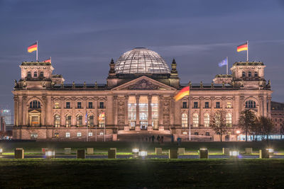 View of illuminated building against sky at night