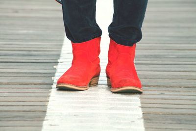 Low section of woman standing on tiled floor