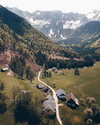 High angle view of trees and houses against mountains