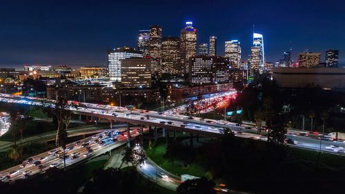 High angle view of illuminated buildings in city at night,los angeles drone view of downtown skyline