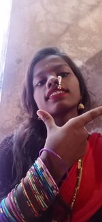 Portrait of young woman looking at camera