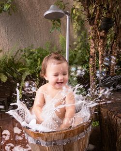 Portrait of shirtless boy in water