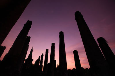 Low angle view of silhouette temple against sky at sunset