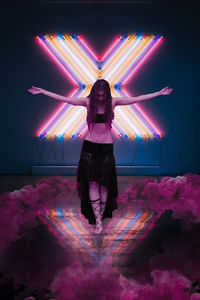 Digital composite image of woman with illuminated lights