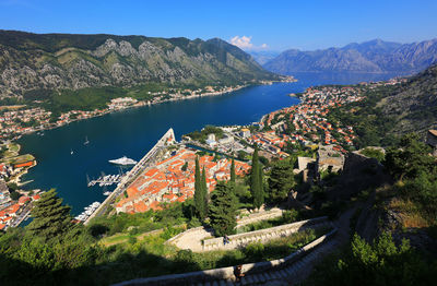 High angle view of kotor town by sea against mountains