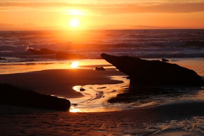 Scenic view of sea against sky during sunset