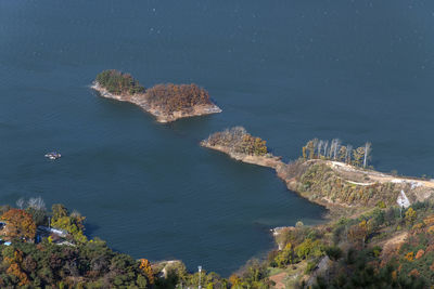 High angle view of rocks by lake