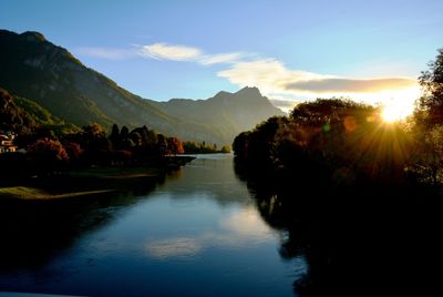 Scenic view of lake against sky during sunset