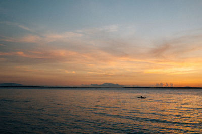 Scenic view of sea at sunset