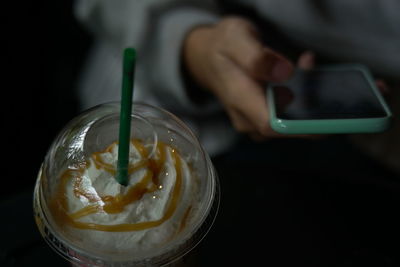 Close-up of hand holding ice cream