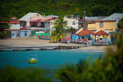 Houses by swimming pool in city