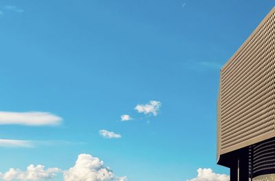 Low angle view of building against blue sky