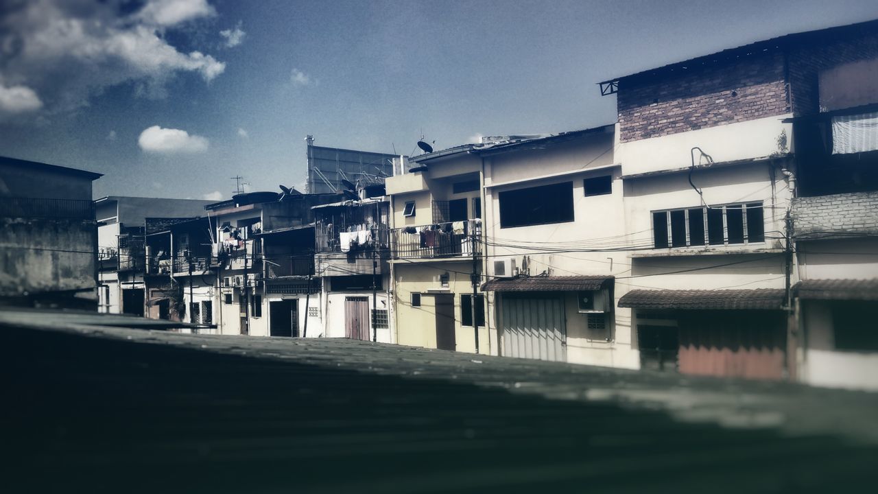 building exterior, architecture, built structure, residential building, residential structure, sky, house, window, building, city, street, railing, residential district, outdoors, day, no people, town, cloud, roof, sunlight