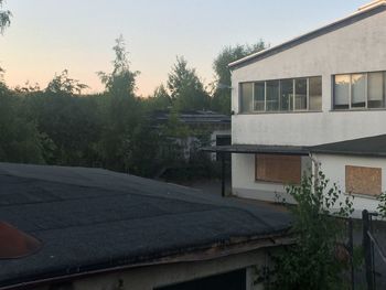 House by trees against sky