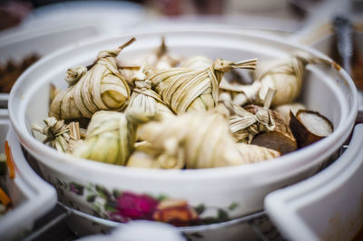 Close-up of ketupats in bowl