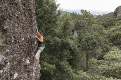 One woman rock climbing in jilotepec, mexico
