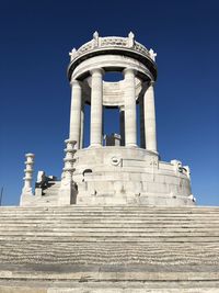 Low angle view of historical building against blue sky