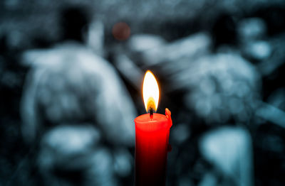 Close-up of illuminated candle