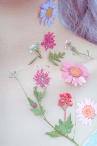 A girl's chest and flowers