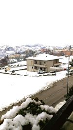 Houses against clear sky during winter