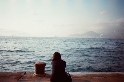 Woman sitting on beach