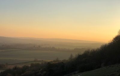 Scenic view of landscape against sky during sunset