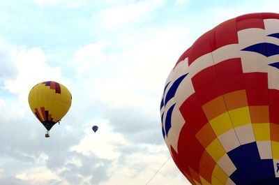 Low angle view of balloons against sky