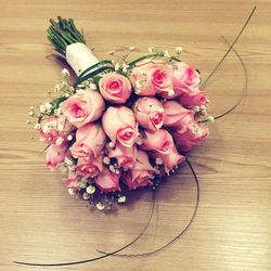 High angle view of pink roses on table