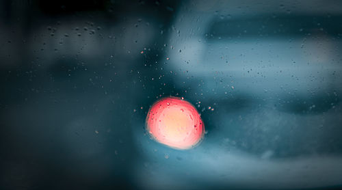 Close-up of raindrops on glass window
