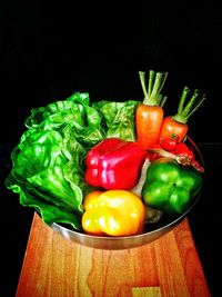 Close-up of bell peppers against black background