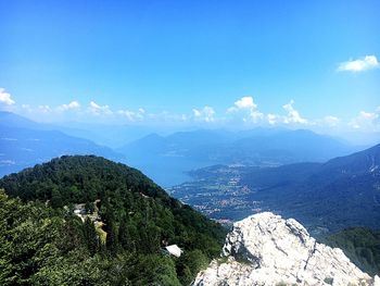 Scenic view of mountains against blue sky