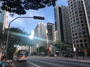 City street and buildings against sky