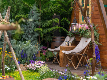 High angle view of empty chairs and tables in greenhouse