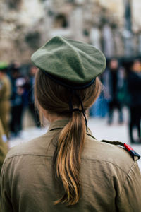 Rear view of woman in park during winter