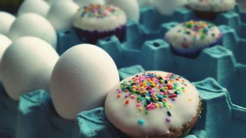 Close-up of cupcake with eggs in crate