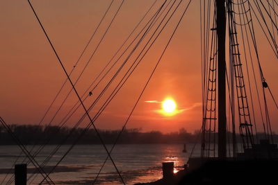 Silhouette of cranes at sunset