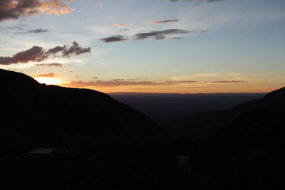 Scenic view of mountains against sky during sunset