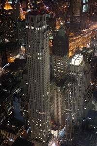 Aerial view of city lit up at night