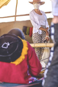 Rear view of woman wearing hat
