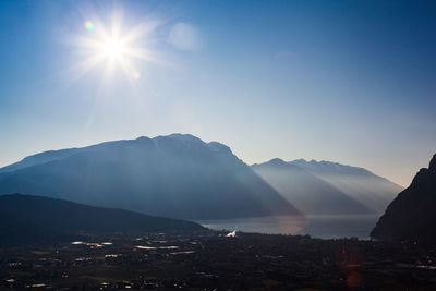 Scenic view of mountains against sky on sunny day