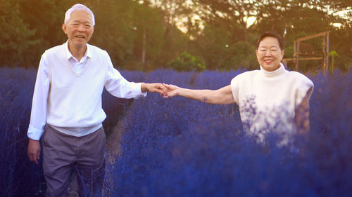 Portrait of a smiling young man standing outdoors