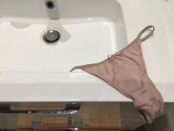 Close-up of panties on sink in bathroom