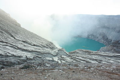 Scenic view of volcanic landscape against sky