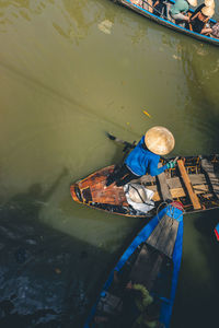 High angle view of man fishing in boat