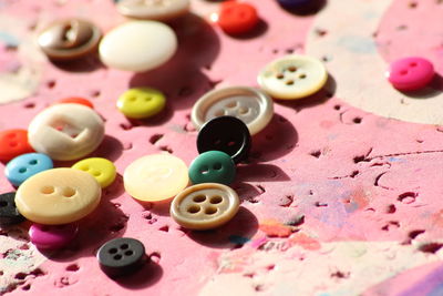 Close-up of colorful buttons on table
