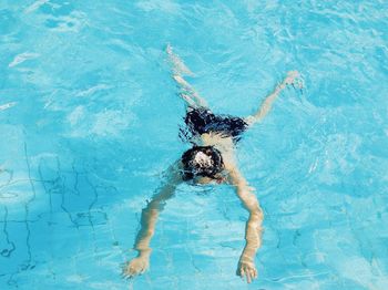 High angle view of man swimming in pool