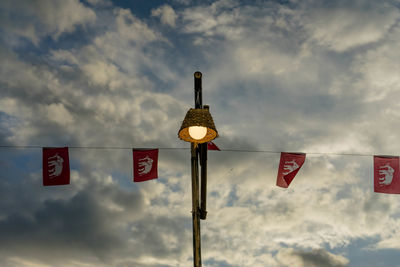 Low angle view of flag against sky