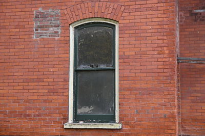 Window on brick wall of building