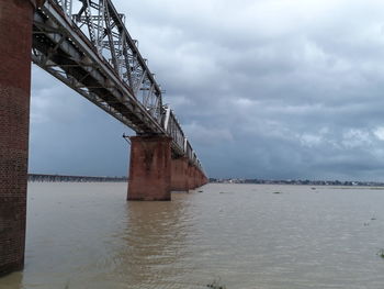 Bridge over sea against sky